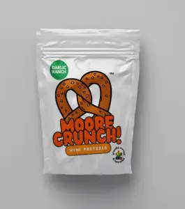 shiny white bag with cute picture of brown pretzel with orange words saying Moore Crunch Mini Pretzels Garlic Ranch