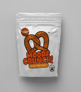 shiny white bag with cute picture of brown pretzel with orange words saying Moore Crunch Mini Pretzels Smokehouse Ranch
